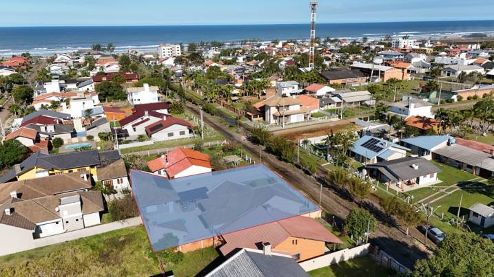 Rodrigues Imóveis em Torres RS | Casa a venda Praia Paraíso com piscina Torres RS
